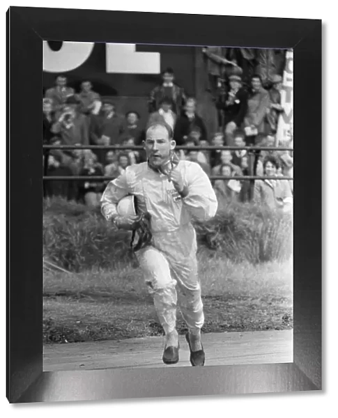 Stirling Moss retires after three laps due to brake issues