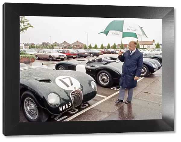 Sterling Moss with a C-Type Jaguar which he piloted to Le Mans 40 years ago