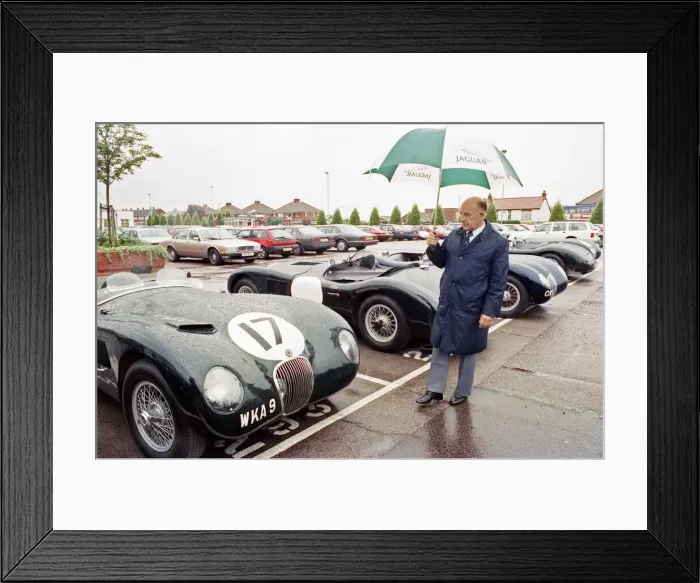 Framed Print : Sterling Moss with a C-Type Jaguar which he piloted to Le Mans 40 years ago