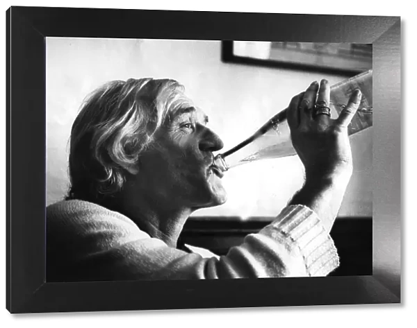 Richard Harris drinking from bottle of water during interview - 22 July 1982