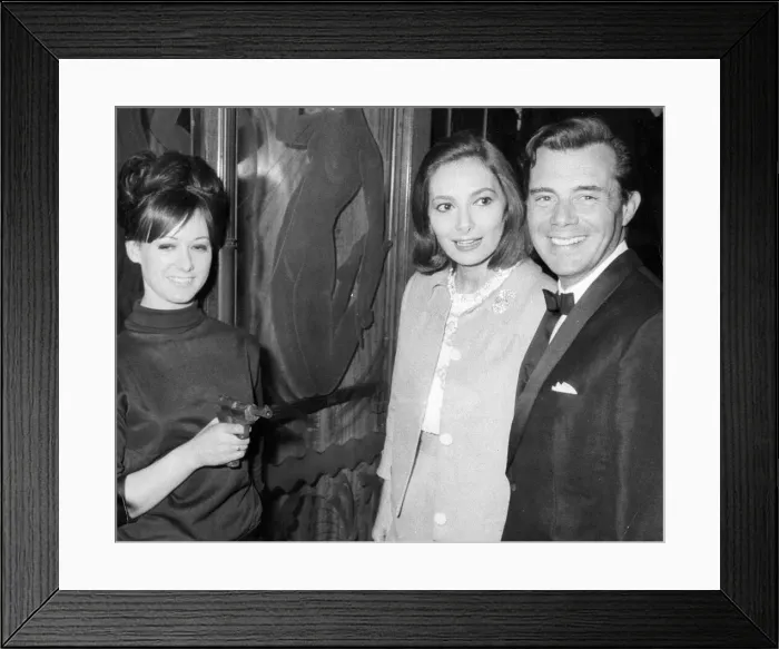 Framed Print : Dirk Bogarde with Rosella Falk at premiere of film Modesty Blaise, London - 19th May 1966 Framed Print : Dirk Bogarde with Rosella Falk at premiere of film Modesty Blaise, London - 19th May 1966