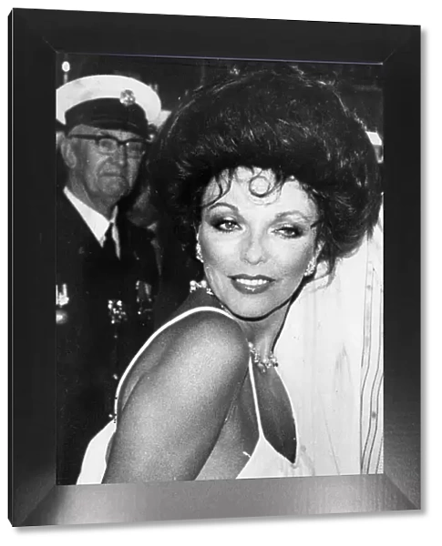 Joan Collins at premiere of The Stud wearing low cut evening gown - April 1978