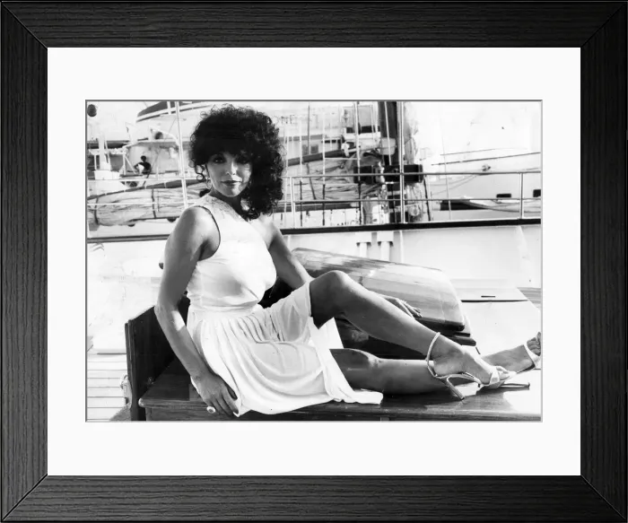 Framed Print : Joan Collins posing on quayside at Cannes film festival - May 1979 Framed Print : Joan Collins posing on quayside at Cannes film festival - May 1979
