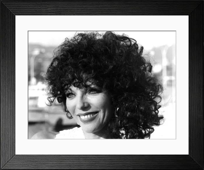 Framed Print : Joan Collins posing on quayside at Cannes film festival - May 1979 Framed Print : Joan Collins posing on quayside at Cannes film festival - May 1979