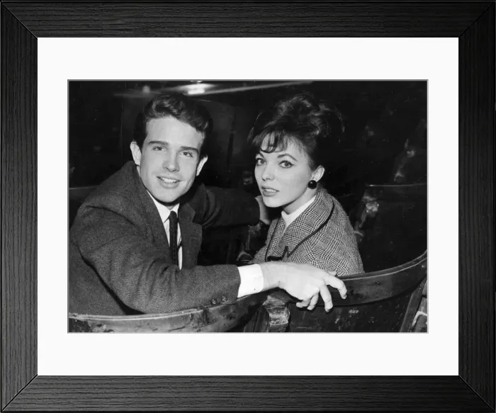 Framed Print : Warren Beatty and fiancee Joan Collins sitting in theatre - February 1961