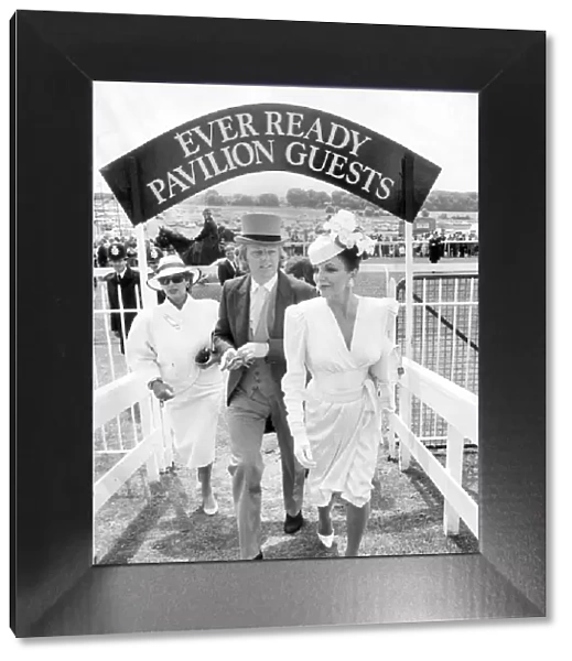 JOAN COLLINS AND HUSBAND PETER HOLM ARRIVING AT EPSOM RACECOURSE 01  /  06  /  1986