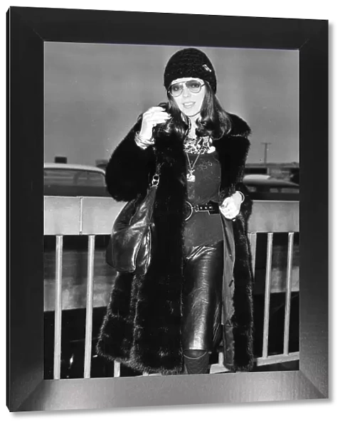 Joan Collins wearing fur coat at London Airport - December 1971