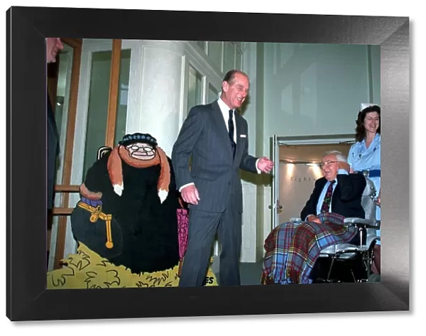 The Duke of Edinburgh, Prince Philip with Cartoonist Carl Giles at exhibition of