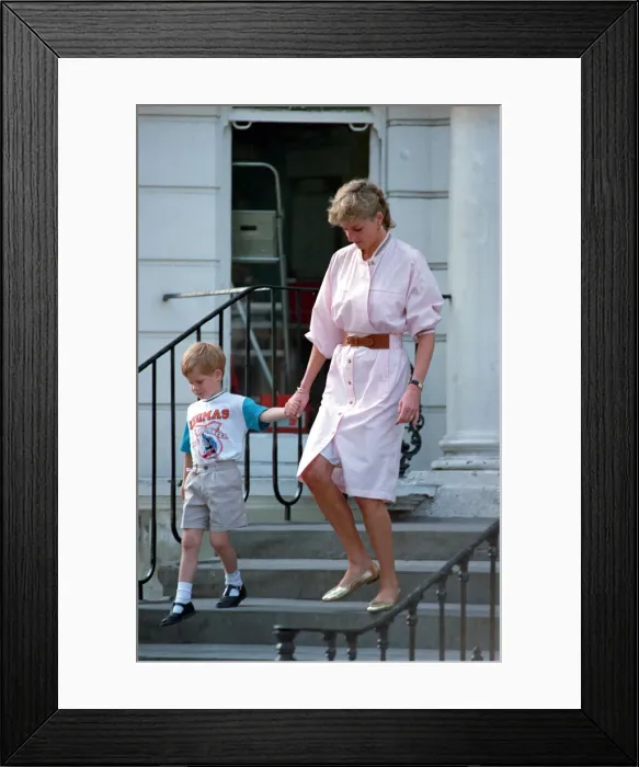 Framed Print : Prince Harry wears a Thomas the Tank Engine tee-shirt when he leaves nursery school with Framed Print : Prince Harry wears a Thomas the Tank Engine tee-shirt when he leaves nursery school with