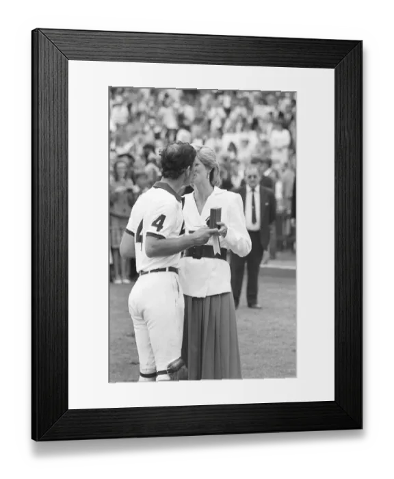 Framed Print : PRINCESS DIANA KISSES PRINCE CHARLES WHILST PRESENTING HIM WITH A POLO TROPHY Framed Print : PRINCESS DIANA KISSES PRINCE CHARLES WHILST PRESENTING HIM WITH A POLO TROPHY