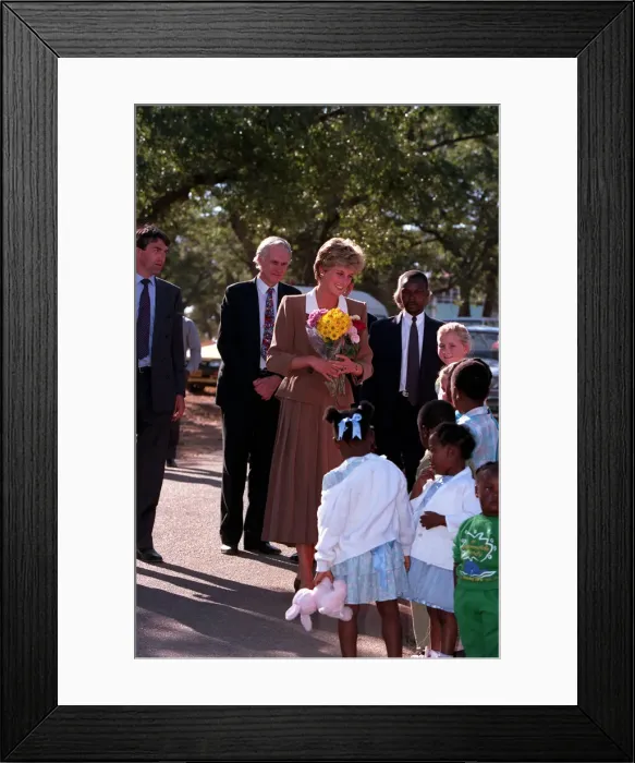 Framed Print : PRINCESS OF WALES GREETING PEOPLE DURING A VISIT TO RED CROSS CHARITY PROJECT IN ZIMBABWE