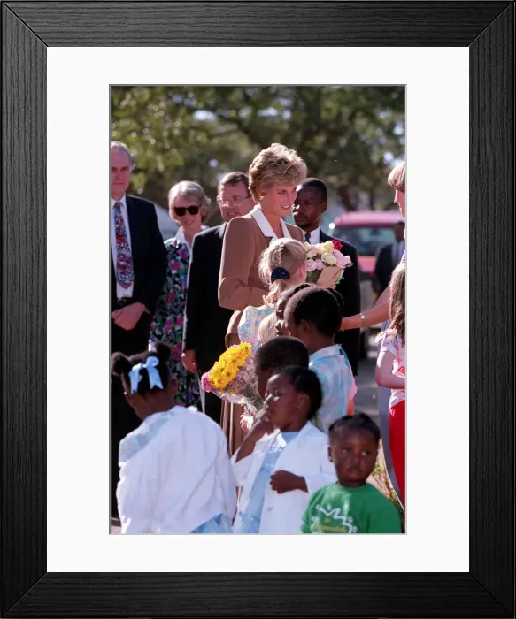 Framed Print : PRINCESS OF WALES GREETING PEOPLE DURING A VISIT TO CHARITY PROJECTS IN ZIMBABWE - JULY