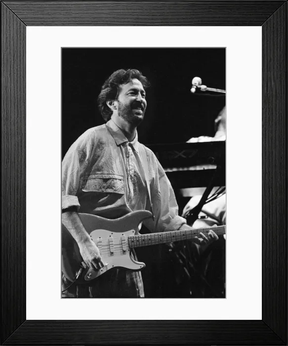 Framed Print : Eric Clapton singer  /  songwriter and guitarist performing at The Birmingham National
