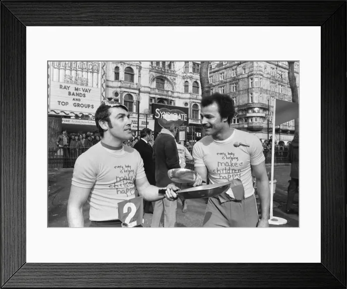 Framed Print : Shrove Tuesday Pancake Racing took place in Leicester Square today
