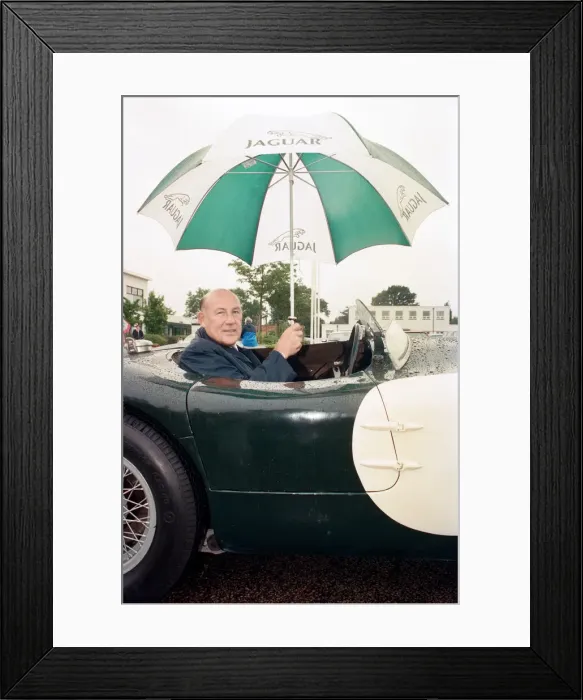 Framed Print : Sterling Moss in a C-Type Jaguar which he piloted to Le Mans 40 years ago