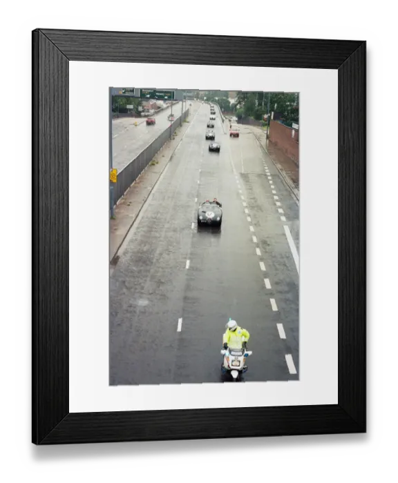 Framed Print : Sterling Moss takes takes Evening Telegraph reporter Alan Poole for a spin in the same Framed Print : Sterling Moss takes takes Evening Telegraph reporter Alan Poole for a spin in the same