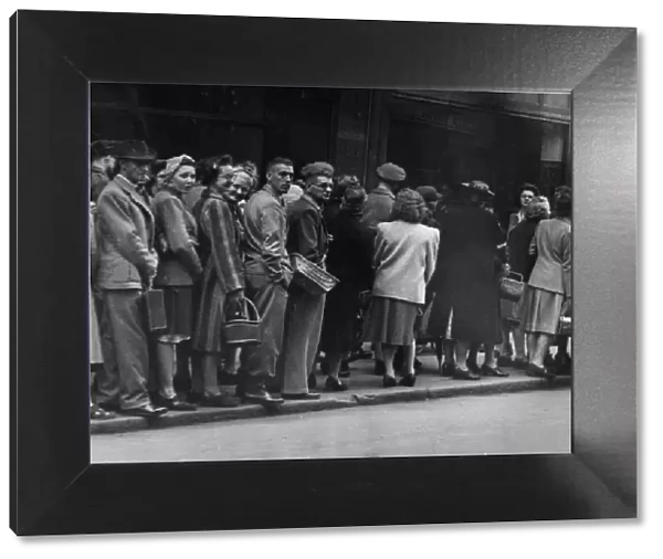 Queues for bread on VJ day in Derby. 15th August 1945