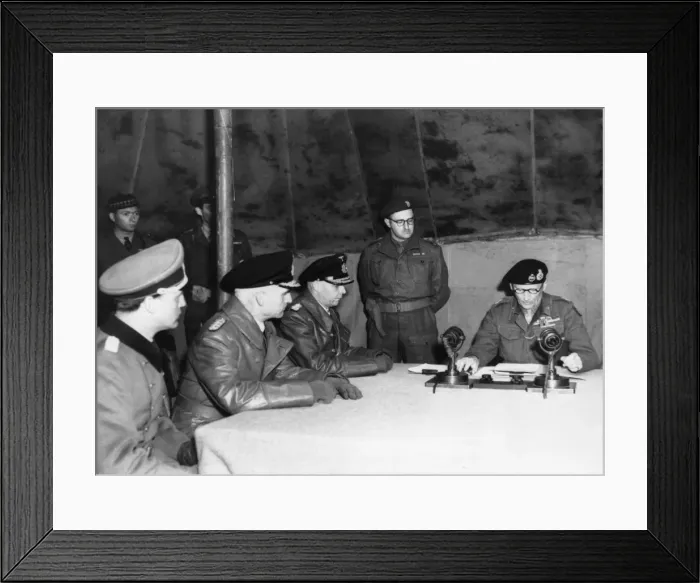 Framed Print : Field Marshal Montgomery (sitting right) reads over the surrender pact at his HQ at 21st Framed Print : Field Marshal Montgomery (sitting right) reads over the surrender pact at his HQ at 21st