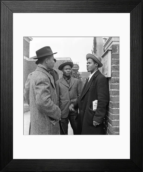 Framed Print : Young West Indian men standing outside the Brixton Labour Exchange looking for employment