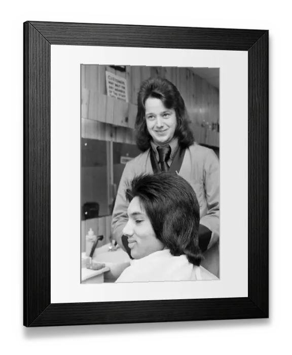 Framed Print : A man who is getting a Kojak'hair cut. 1975