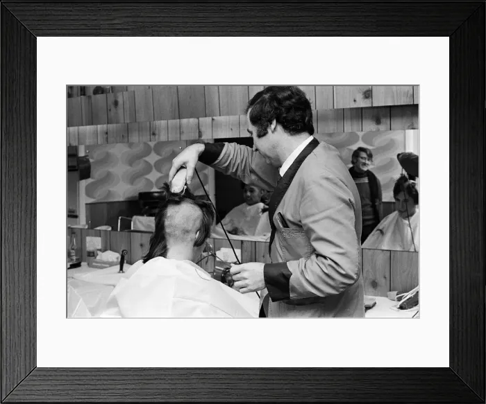 Framed Print : A man getting a Kojak'hair cut. 1975 Framed Print : A man getting a Kojak'hair cut. 1975