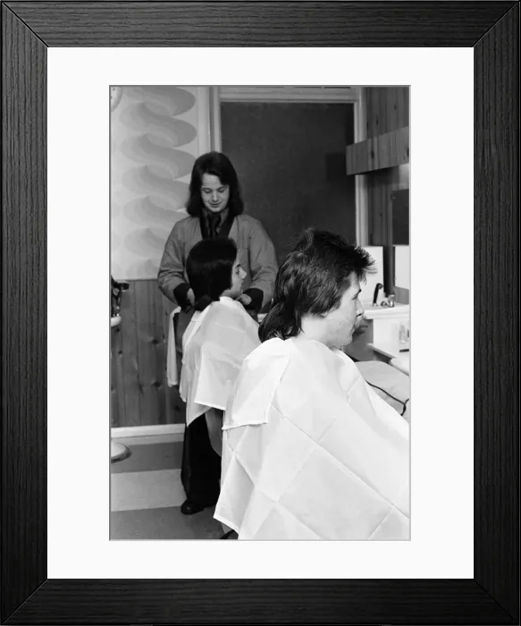 Framed Print : Two men who are getting Kojak'hair cuts. 1975 Framed Print : Two men who are getting Kojak'hair cuts. 1975