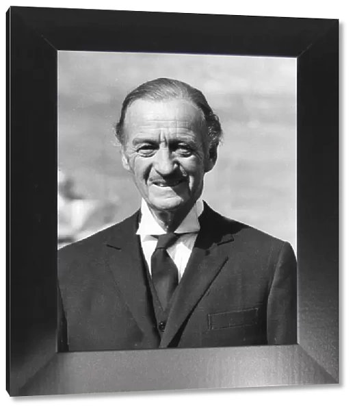 David Niven dressed as butler while filming Candleshoe in England - September 1976