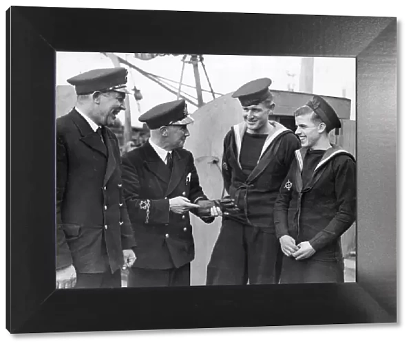 Picture shows a cheery exchange of officers and crew on the HMT Kirkella