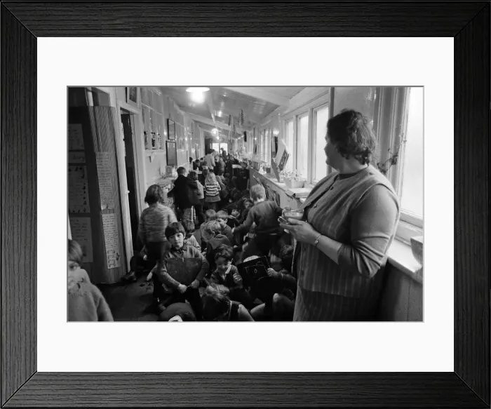 Framed Print : Some of the 180 children play in the small corridor at Sacred Heart RC school, Gorton