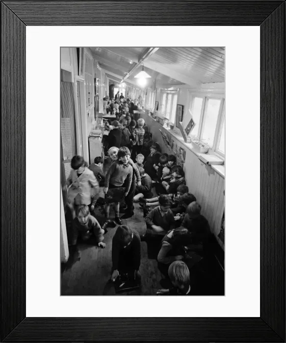 Framed Print : Some of the 180 children play in the small corridor at Sacred Heart RC school, Gorton Framed Print : Some of the 180 children play in the small corridor at Sacred Heart RC school, Gorton