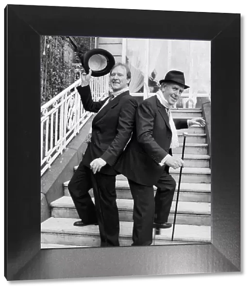 George Cole and Dennis Waterman at Minder photocall dancing on steps 04  /  12  /  1988