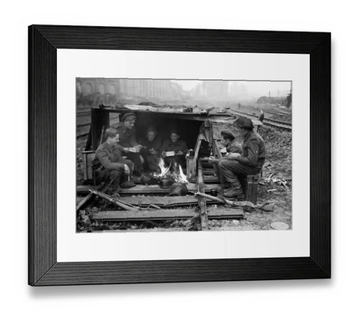 Framed Print : British soldiers keep themselves warm and have some food during a break in fighting Framed Print : British soldiers keep themselves warm and have some food during a break in fighting