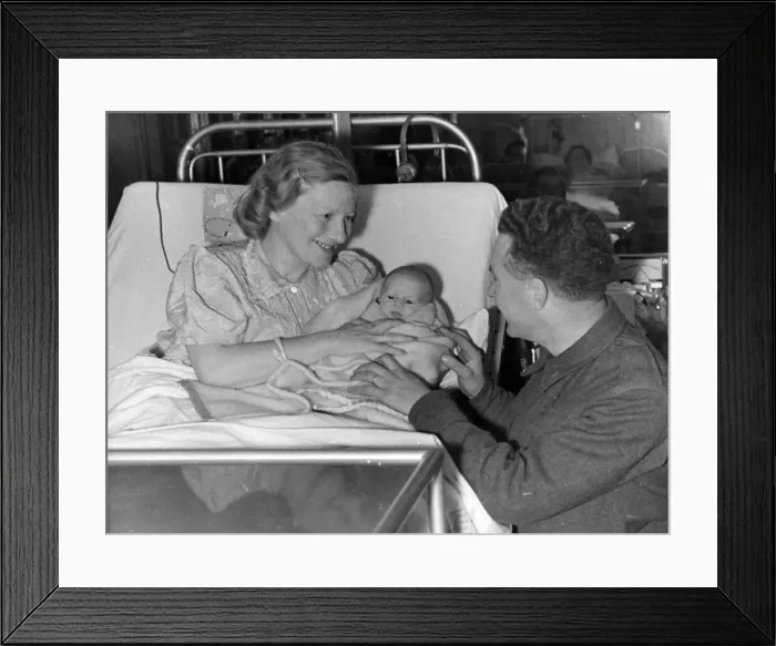 Framed Print : Czech-Slovak soldier being introduced to his new baby. 1940 Framed Print : Czech-Slovak soldier being introduced to his new baby. 1940
