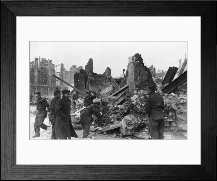 Framed Print : Clearing away rubble at a scene of destruction in London following an air raid during Framed Print : Clearing away rubble at a scene of destruction in London following an air raid during