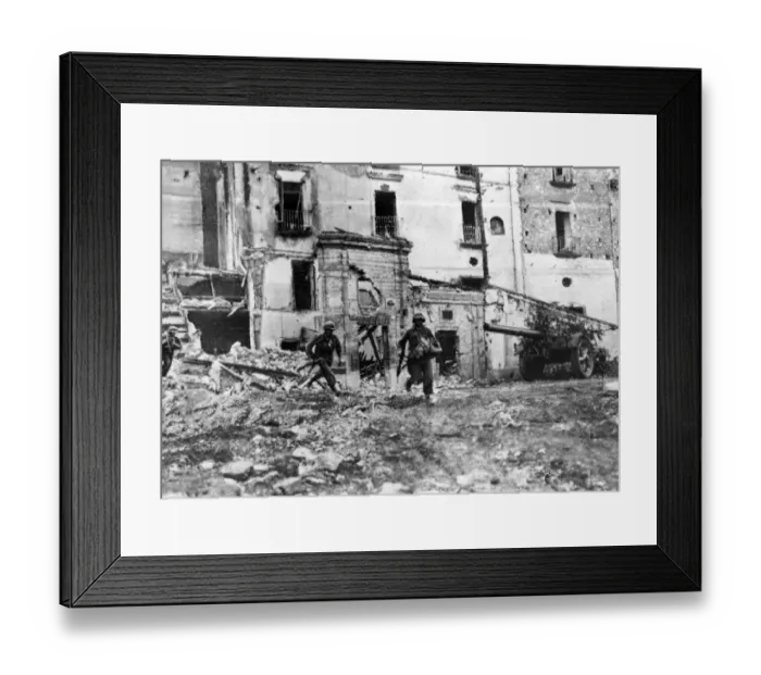 Framed Print : Men of American Infantry regiment moving across an open square in Itri while the town is Framed Print : Men of American Infantry regiment moving across an open square in Itri while the town is