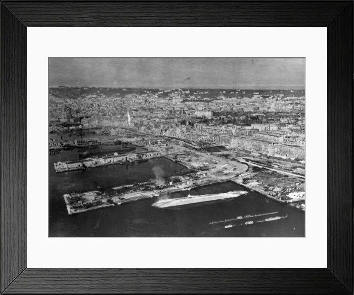 Framed Print : Wrecked and capsized enemy merchant vessels line the quays in the harbour at Naples