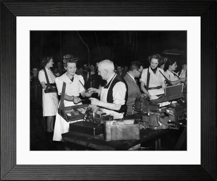 Framed Print : Munition girls selling war certificates to workers in their factory in the Midlands Framed Print : Munition girls selling war certificates to workers in their factory in the Midlands