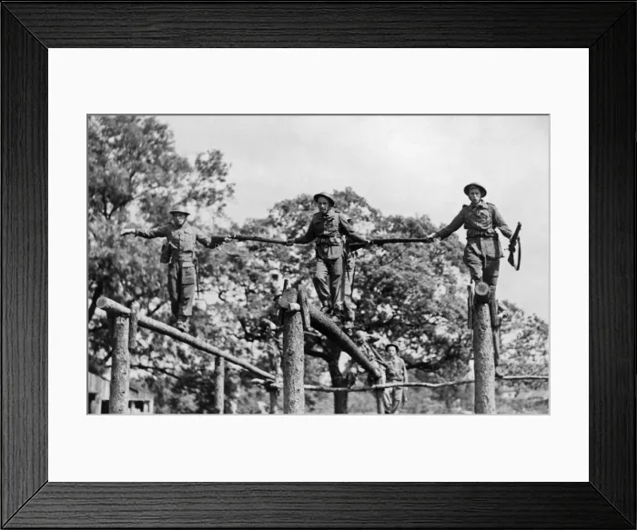 Framed Print : Soldiers crossing a log bridge during an inter-team competition held on an East Riding Framed Print : Soldiers crossing a log bridge during an inter-team competition held on an East Riding