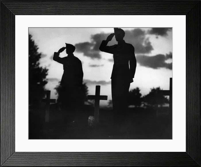 Framed Print : Soldiers salute at a cemetery as they remember comrades that died during the Battle Framed Print : Soldiers salute at a cemetery as they remember comrades that died during the Battle