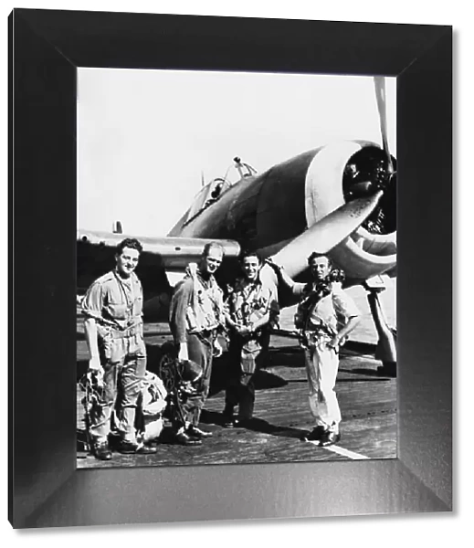 (Picture shows) The four pilots of a section of a Hellcat fighter squadron serving with
