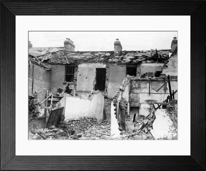 Framed Print : Damage to a house property caused by a bomb which fell in a Welsh town. Circa 1941