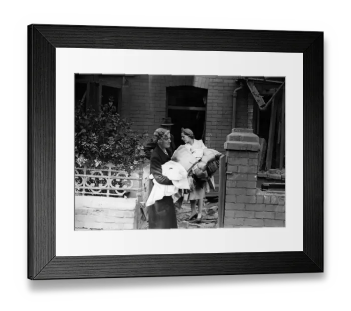 Framed Print : A family with their belongings after an air raid in a South Wales Town. Circa 1941 Framed Print : A family with their belongings after an air raid in a South Wales Town. Circa 1941