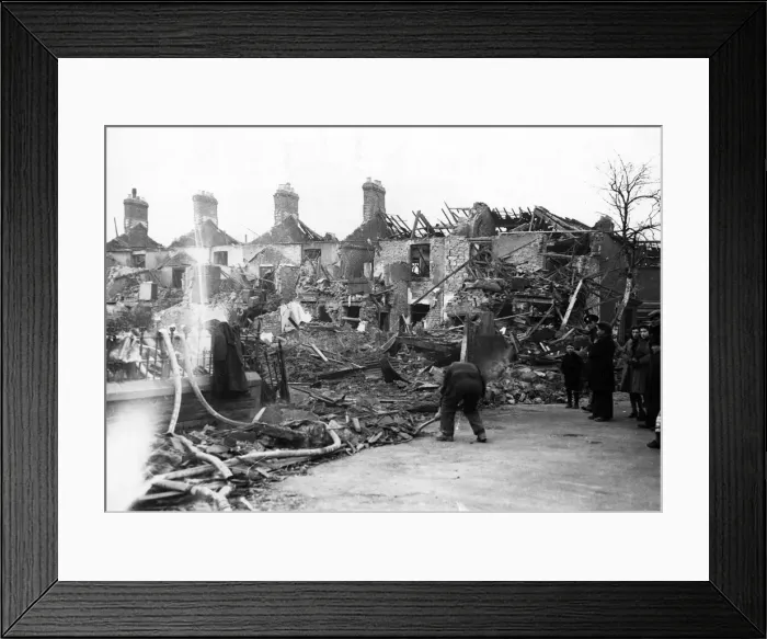 Framed Print : Clearing away the debris from damaged properties in a South Wales town. Circa 1941