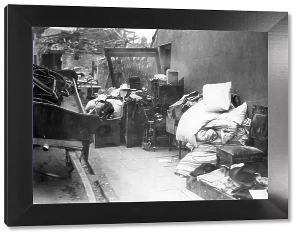 Furniture and bedding from a blitzed building in Roath, Cardiff. Circa 1941