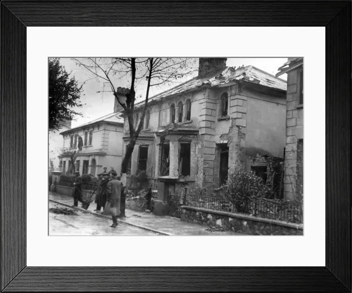 Framed Print : Wreckage after a bomb had dropped in this street in a Welsh town. Circa 1941 Framed Print : Wreckage after a bomb had dropped in this street in a Welsh town. Circa 1941
