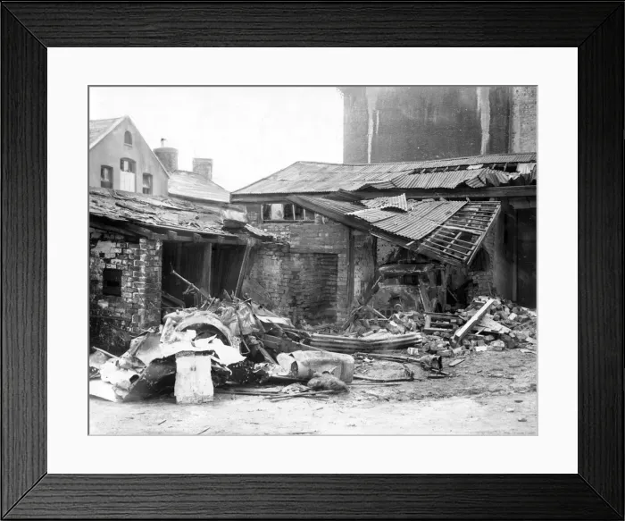 Framed Print : A bomb in this yard caused damage to a motor car and a small building, Cardiff, Wales Framed Print : A bomb in this yard caused damage to a motor car and a small building, Cardiff, Wales