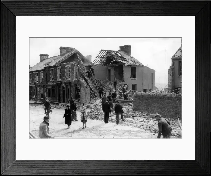 Framed Print : One person was killed when a bomb dropped by a lone raider over a Welsh town on Tuesday