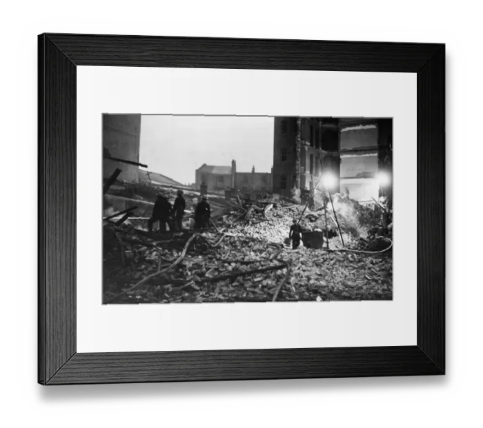 Framed Print : Firemen hosing the smouldering ruins of a factory, whilst still searching for Framed Print : Firemen hosing the smouldering ruins of a factory, whilst still searching for