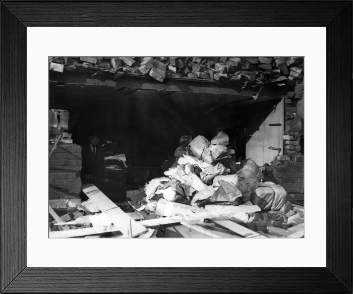 Framed Print : Salvaging stock in Canton, Cardiff, following a Nazi air raid. Circa 1941 Framed Print : Salvaging stock in Canton, Cardiff, following a Nazi air raid. Circa 1941