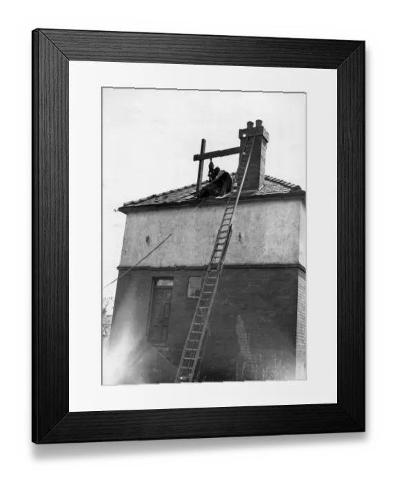 Framed Print : A large stone flung on a roof during a blitz in South Wales. Circa 1941 Framed Print : A large stone flung on a roof during a blitz in South Wales. Circa 1941